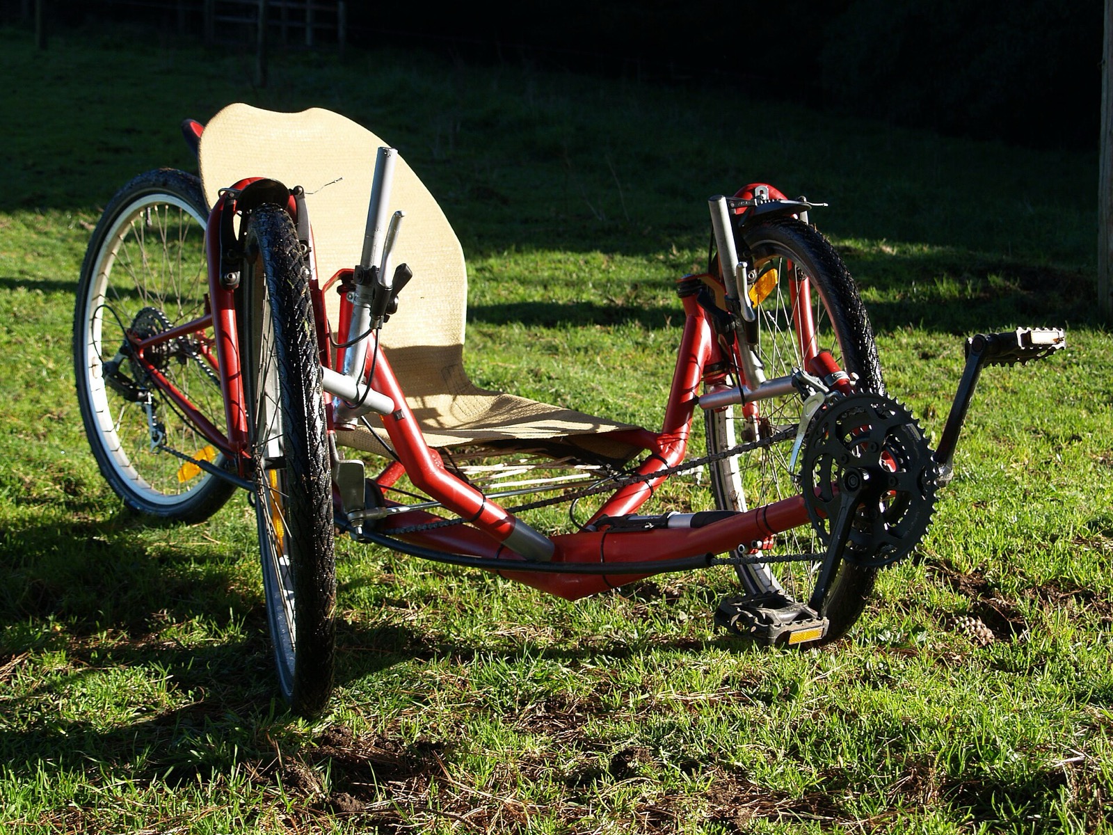 A homebuilt tadpole recumbent trike with two wheels at the front and one at the rear