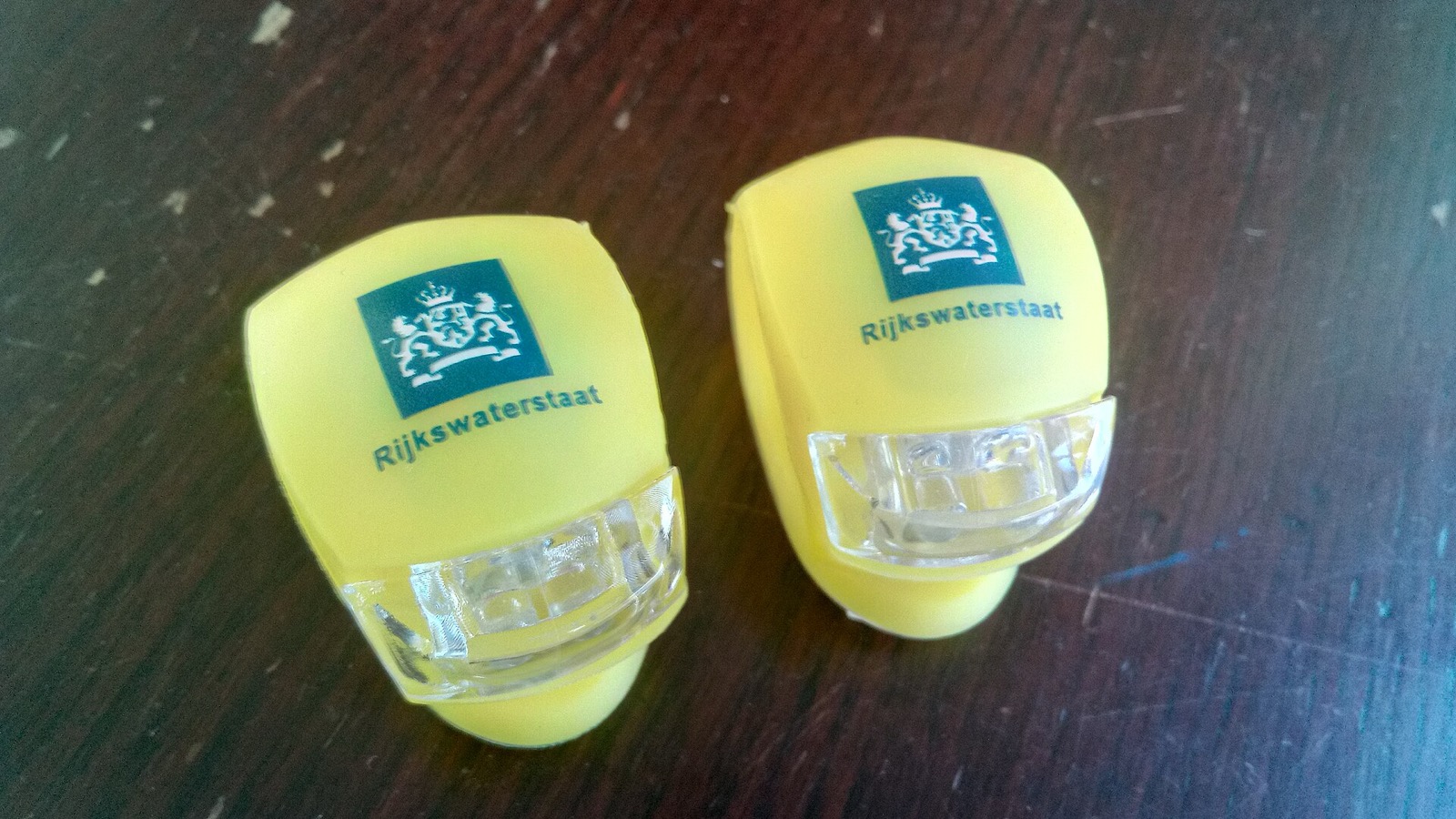 Two small clip-on LED bicycle lights