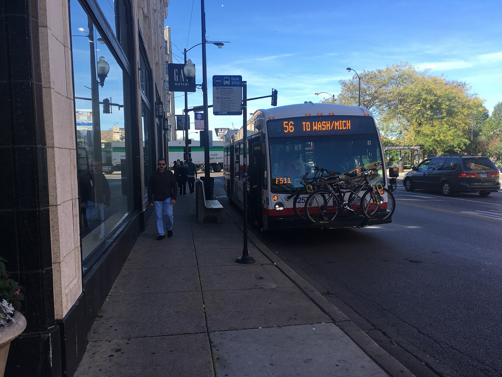 A CTA bus with bikes loaded on its front rack