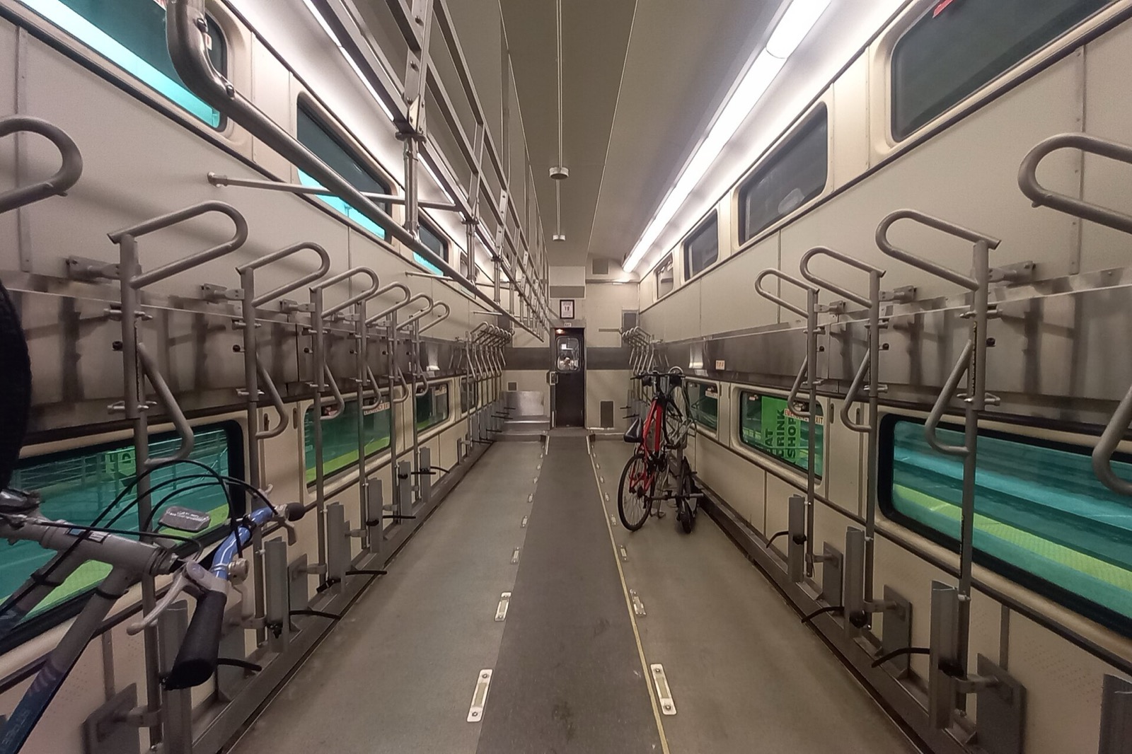Interior of a Metra bike car with wall-mounted racks and bikes aboard