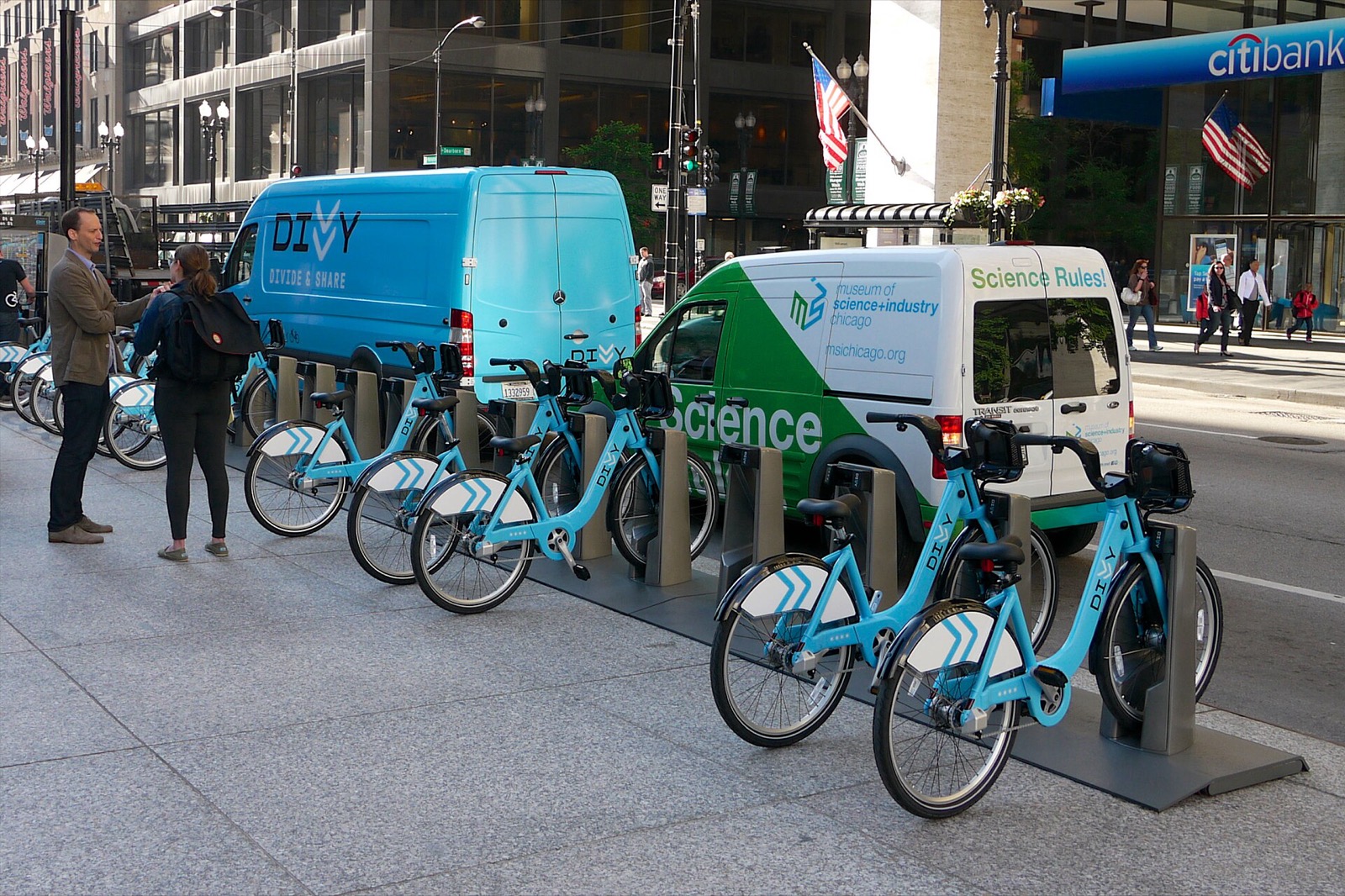 Docked blue Divvy bikes at the Dearborn St and Washington St station in the Loop