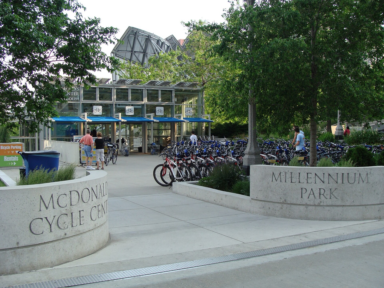 Front of the former McDonald's Cycle Center, a glass atrium behind bike racks at Millennium Park