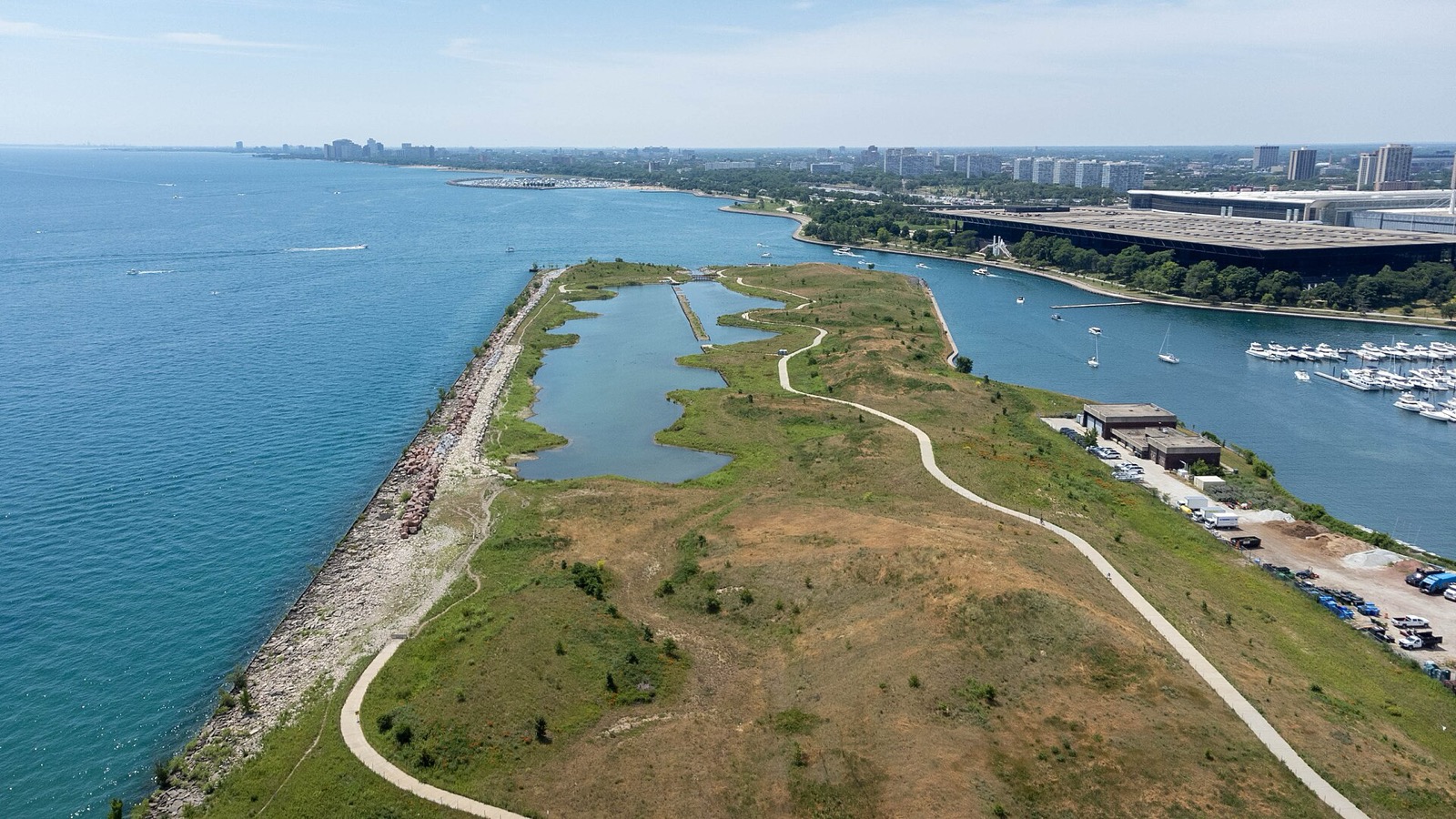 Aerial view of the Northerly Island path winding past a lagoon beside Lake Michigan