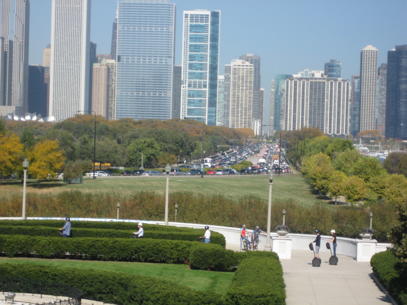 Segway riders on the walkway above Museum Campus with the Chicago skyline behind